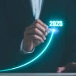 Businessman using pen drawing line for increasing arrow from 2024 to 2025